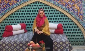 Iranian woman with headscarf in historical site